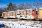 An autorack still in Conrail paint rolls over Snake Hill Road